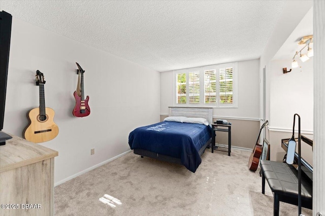 carpeted bedroom featuring a textured ceiling