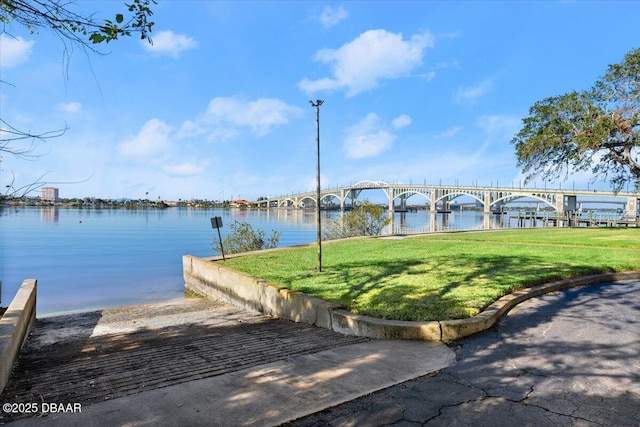 exterior space featuring a water view and a yard