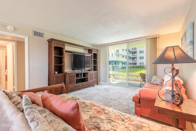 2727 N Atlantic Ave Unit 107, Daytona Beach, FL 32118 - living area with a textured ceiling and carpet floors