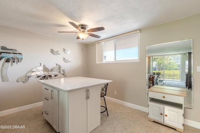 2727 N Atlantic Ave Unit 107, Daytona Beach, FL 32118 - office area with a ceiling fan, light tile patterned floors, and a textured ceiling