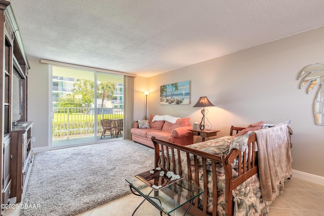 2727 N Atlantic Ave Unit 107, Daytona Beach, FL 32118 - living room featuring a textured ceiling, tile patterned flooring, and carpet flooring