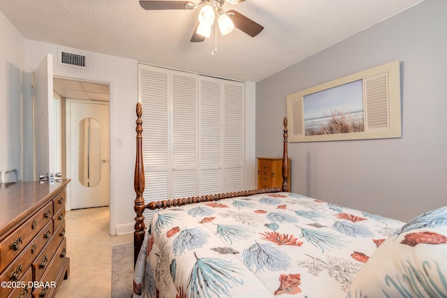 2727 N Atlantic Ave Unit 107, Daytona Beach, FL 32118 - bedroom with a closet, light tile patterned floors, and a ceiling fan