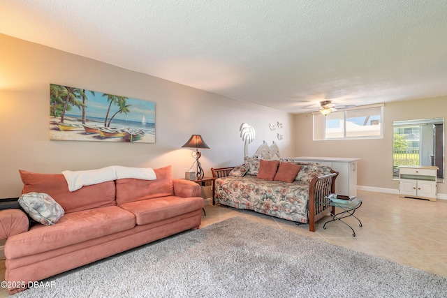 2727 N Atlantic Ave Unit 107, Daytona Beach, FL 32118 - living area with ceiling fan, a textured ceiling, and light tile patterned flooring