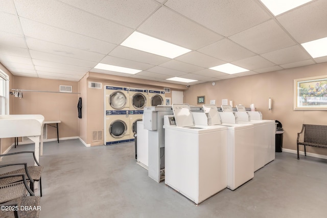 2727 N Atlantic Ave Unit 107, Daytona Beach, FL 32118 - communal laundry room featuring stacked washer / drying machine and separate washer and dryer