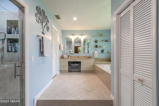 bathroom featuring vanity, tile patterned floors, and an enclosed shower