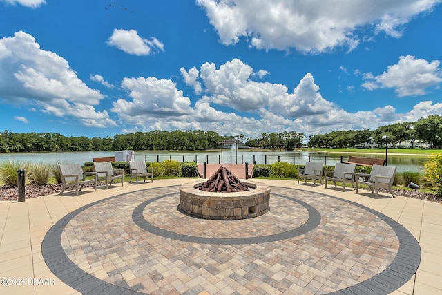 view of patio / terrace featuring a water view and an outdoor fire pit