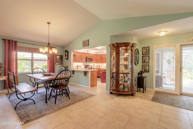 dining area with light tile patterned floors, plenty of natural light, and lofted ceiling