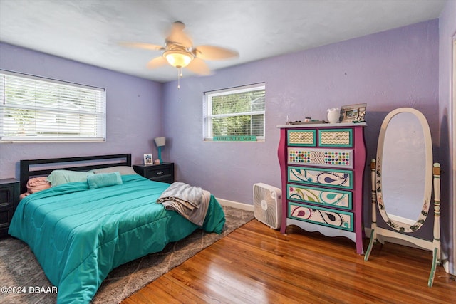 bedroom featuring hardwood / wood-style flooring and ceiling fan