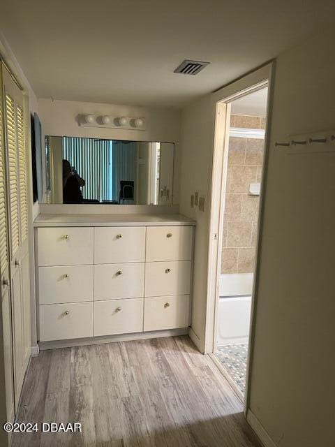 bathroom featuring hardwood / wood-style floors and vanity