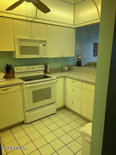 kitchen with ceiling fan, white appliances, and light tile patterned floors