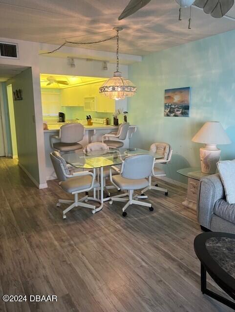 dining area with hardwood / wood-style flooring