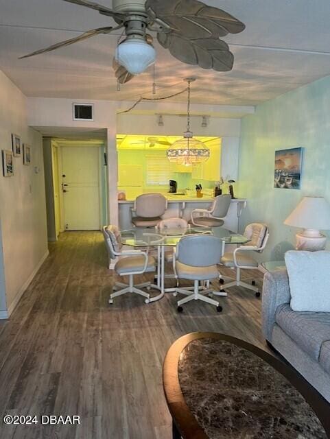 dining room with wood-type flooring and ceiling fan