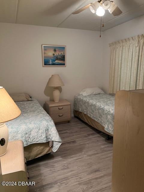 bedroom featuring hardwood / wood-style flooring and ceiling fan