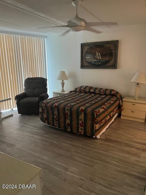 bedroom with dark wood-type flooring and ceiling fan