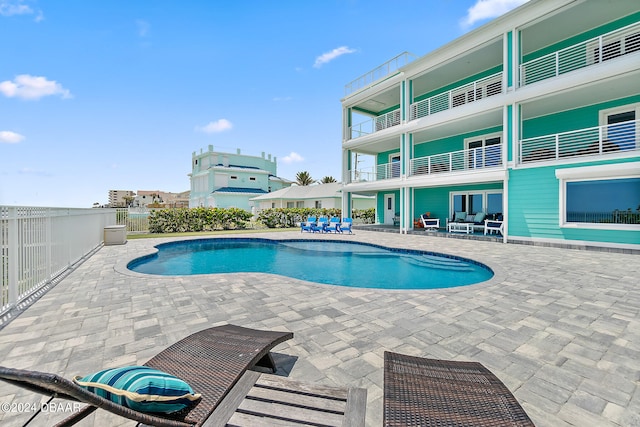 view of swimming pool with a patio