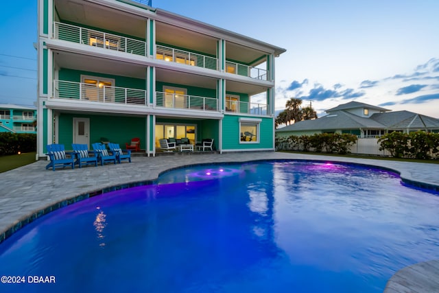 view of swimming pool with a patio and an outdoor living space