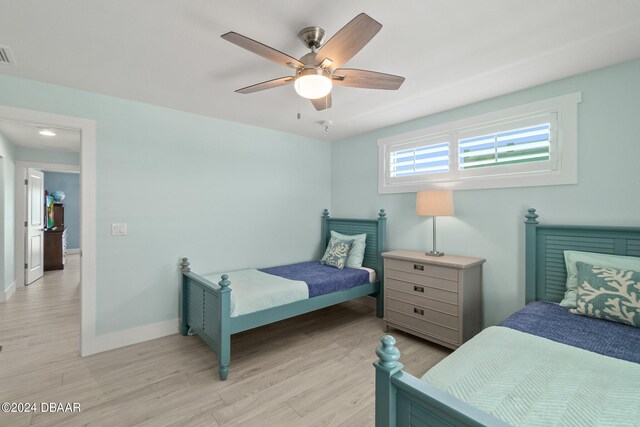 bedroom featuring light hardwood / wood-style flooring and ceiling fan