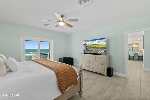 bedroom with access to exterior, light hardwood / wood-style flooring, and ceiling fan