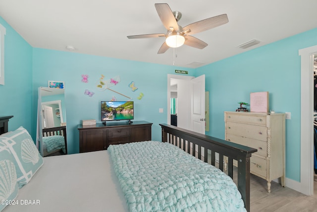 bedroom featuring ceiling fan and light hardwood / wood-style flooring