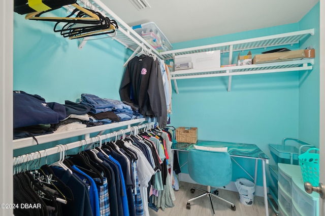 walk in closet featuring hardwood / wood-style floors