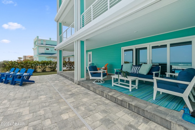 view of patio / terrace with a balcony and an outdoor hangout area