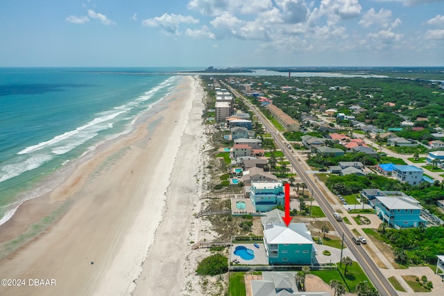 bird's eye view with a beach view and a water view