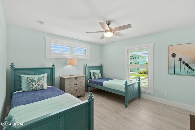 bedroom featuring light hardwood / wood-style floors and ceiling fan