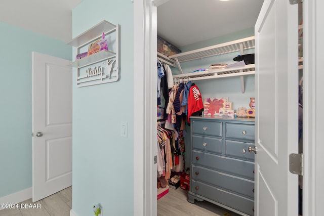 spacious closet featuring light hardwood / wood-style floors