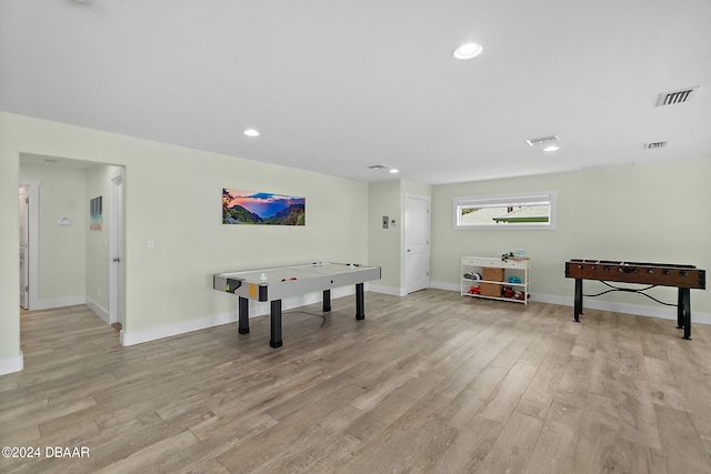 playroom featuring light wood-type flooring