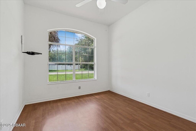 49 Ludlow Ln W W, Unit W, Palm Coast, FL 32137 - spare room featuring wood finished floors, plenty of natural light, a ceiling fan, and baseboards