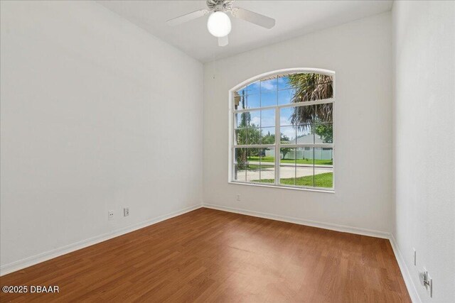 49 Ludlow Ln W W, Unit W, Palm Coast, FL 32137 - spare room with wood finished floors, ceiling fan, and baseboards