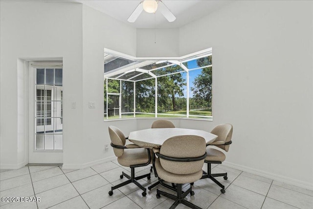 49 Ludlow Ln W W, Unit W, Palm Coast, FL 32137 - dining area featuring a sunroom, a ceiling fan, healthy amount of natural light, and baseboards
