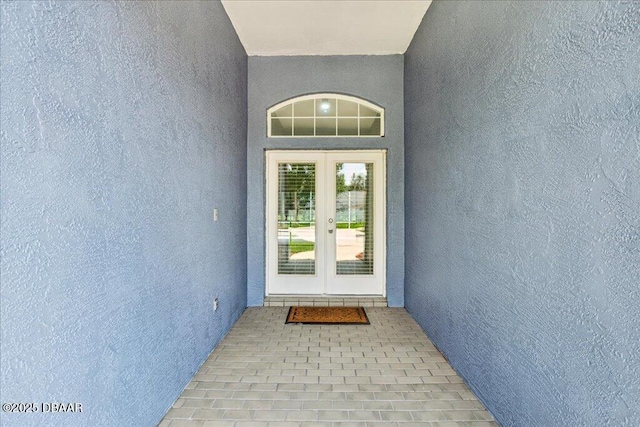 49 Ludlow Ln W W, Unit W, Palm Coast, FL 32137 - doorway to property featuring stucco siding and french doors