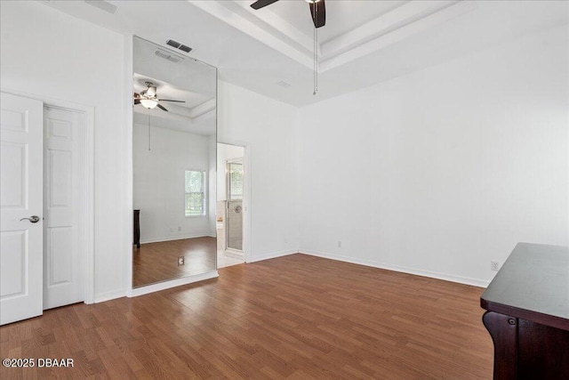 49 Ludlow Ln W W, Unit W, Palm Coast, FL 32137 - unfurnished bedroom with a raised ceiling, wood finished floors, and ceiling fan
