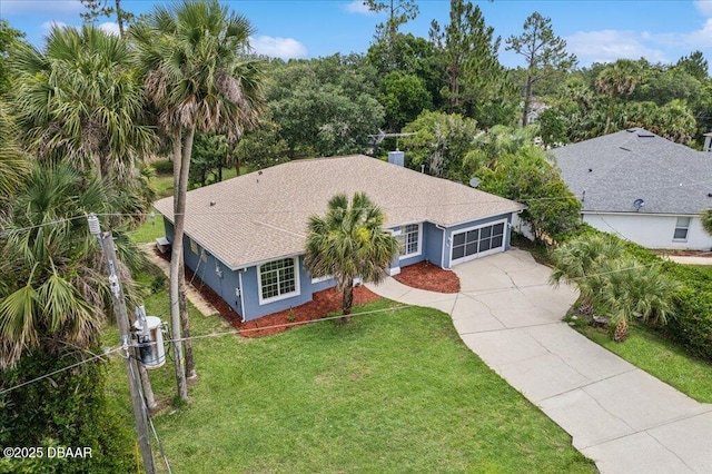 49 Ludlow Ln W W, Unit W, Palm Coast, FL 32137 - view of front of house with a garage, driveway, a front yard, and stucco siding