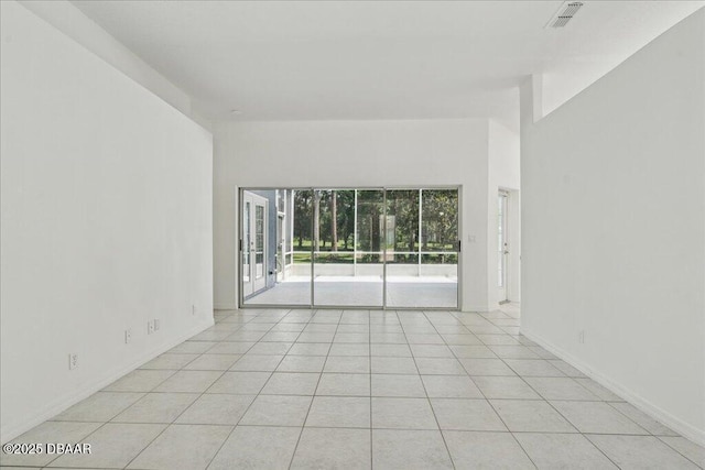 49 Ludlow Ln W W, Unit W, Palm Coast, FL 32137 - unfurnished room featuring light tile patterned floors and baseboards