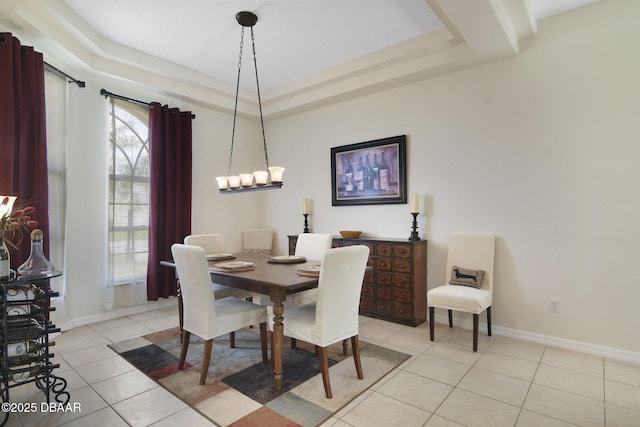 2141 Springwater Ln, Port Orange, FL 32128 - dining room with light tile patterned floors and a tray ceiling