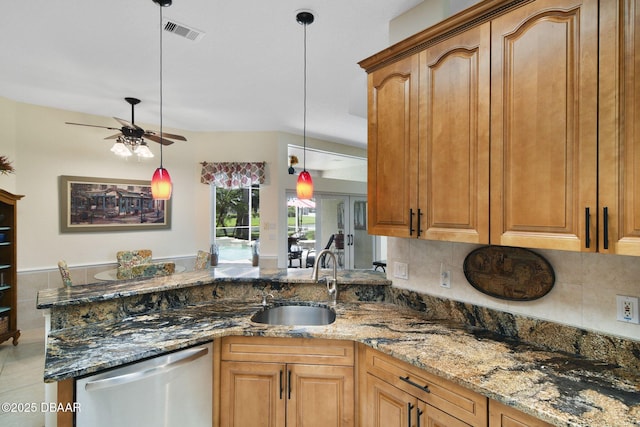 2141 Springwater Ln, Port Orange, FL 32128 - kitchen with stainless steel dishwasher, a ceiling fan, stone countertops, and backsplash