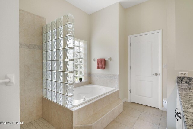 2141 Springwater Ln, Port Orange, FL 32128 - full bathroom featuring tile patterned floors, a garden tub, vanity, and a walk in shower