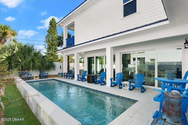 view of pool with a fenced in pool, a patio, and fence