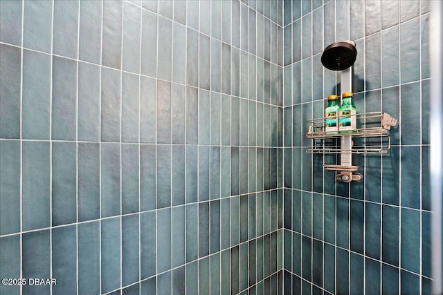 bathroom with a tile shower