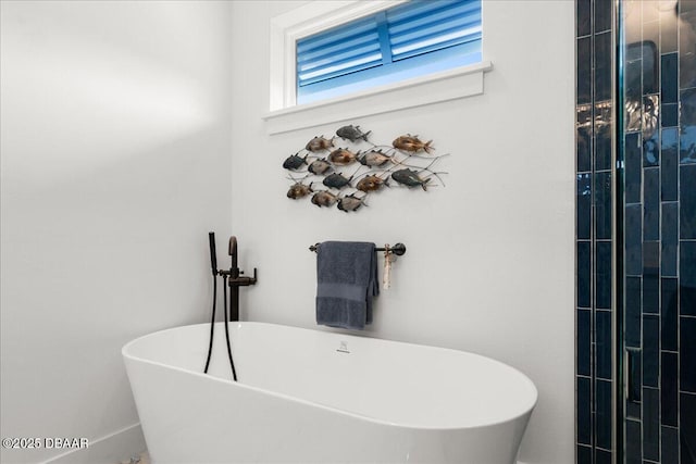 bathroom with a soaking tub