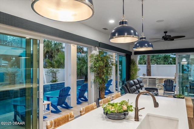 interior space featuring a wealth of natural light, visible vents, and a sink