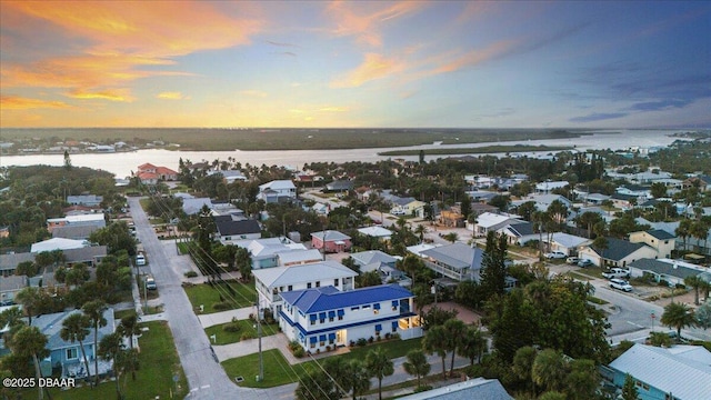 birds eye view of property with a residential view and a water view