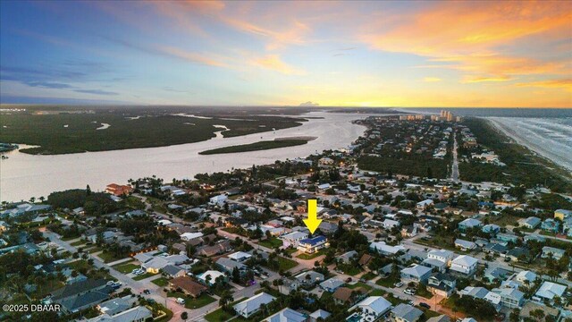 bird's eye view featuring a water view and a residential view