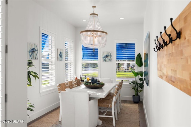 dining room with recessed lighting, baseboards, and a chandelier