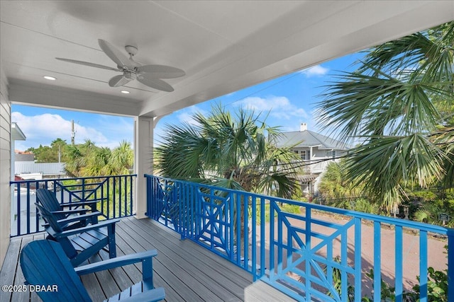 wooden terrace featuring ceiling fan