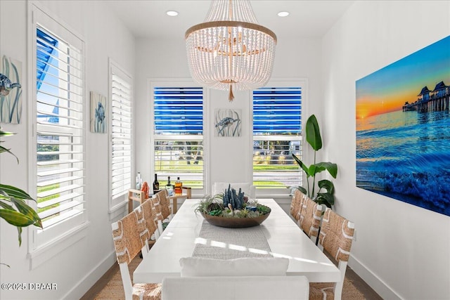 dining area featuring a notable chandelier, recessed lighting, and baseboards