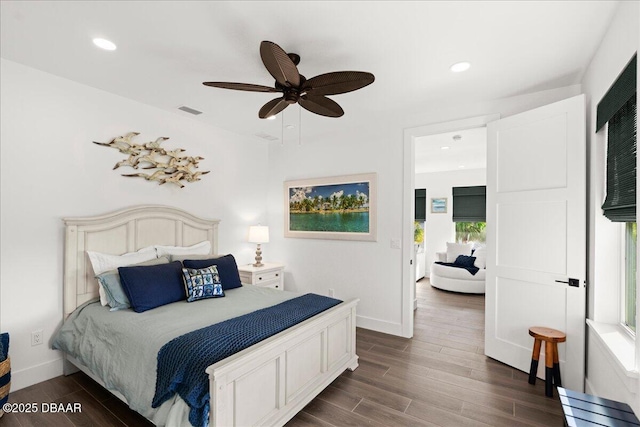 bedroom with ceiling fan and dark hardwood / wood-style floors