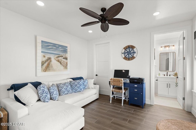 living room featuring a ceiling fan, recessed lighting, and wood tiled floor